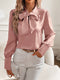 Pink satin blouse with bow for elegant women