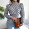 Top incrociato in maglia con texture e colore