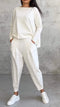 Casual summer women's set with loose sweater and tapered pants